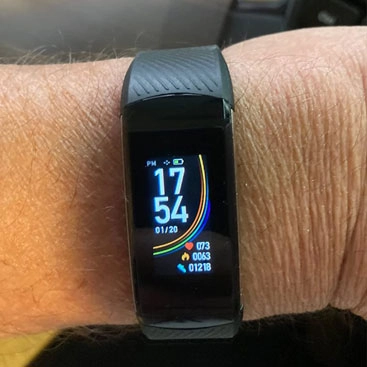 senior wearing a black vitalfit track smartwatch 2